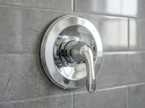 Close-up of a new shower mixing valve and copper supply lines