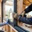 Handyman fitting a sliding patio door panel into its track