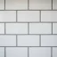 Close-up of grout lines between freshly laid floor tiles