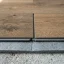 Close-up of interlocking vinyl laminate plank edges