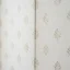 Close-up of wallpaper seam being aligned and pressed flat