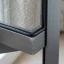 Close-up of spline securing fresh mesh in a window screen frame