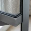 Close-up of spline securing fresh mesh in a window screen frame
